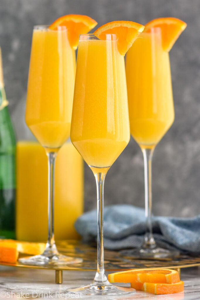 Side view of Non Alcoholic Mimosas garnished with orange slices