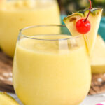 Non Alcoholic Pina Colada garnished with pineapple and a cherry