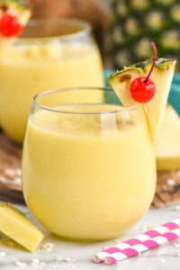 Non Alcoholic Pina Colada garnished with pineapple and a cherry