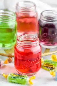 Photo of Jolly Rancher shots with Jolly Rancher candies beside