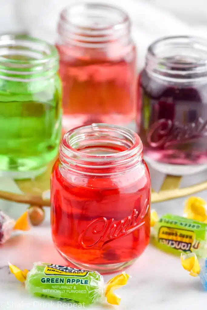 Photo of Jolly Rancher shots with Jolly Rancher candies beside