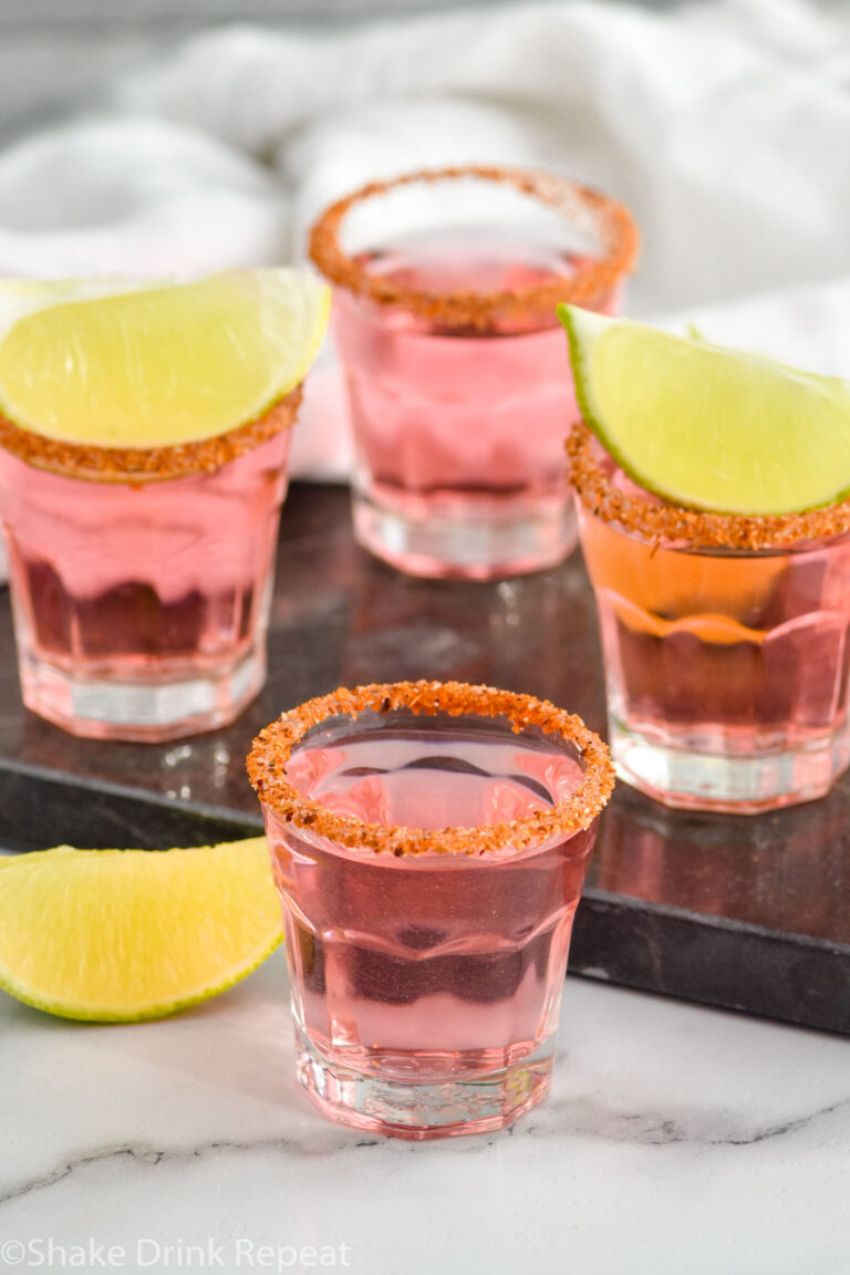 Mexican Candy Shots with salted rims and lime wedges
