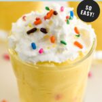 Pinterest graphic for birthday cake pudding shot. Text says "birthday cake pudding shots make with 5 ingredients so easy! shakedrinkrepeat.com" Image shows a birthday cake pudding shot topped with whipped cream and sprinkles