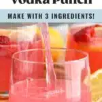 Pinterest graphic for Pink Lemonade Vodka Punch. Text says "Pink Lemonade Vodka Punch so easy! Make with 3 ingredients! shakedrinkrepeat.com" Image shows a pitcher of Pink Lemonade Vodka Punch pouring into a glass. Fresh raspberries and lemon slice surrounding.