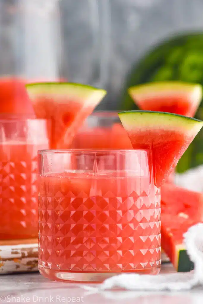 Watermelon rum punch garnished with slices of watermelon