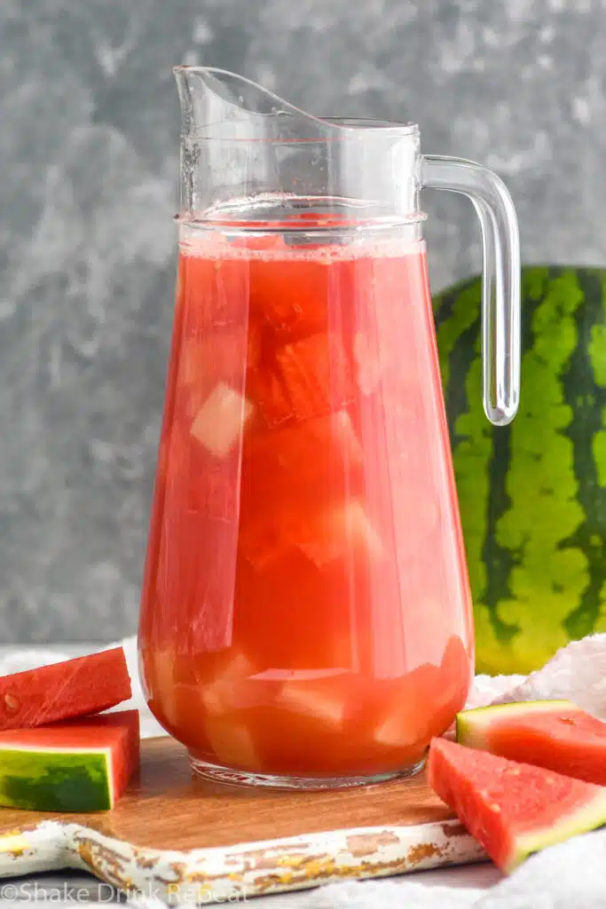 Pitcher of Watermelon rum punch with watermelon beside