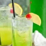 Pinterest graphic for Tokyo Tea. Text says "the best Tokyo Tea uses 8 simple ingredients! shakedrinkrepeat.com" Image shows a glass of Tokyo Tea with ice, straw, lemon slice, and cherry. Glass of Tokyo Tea, cherries, and lemon slice sitting in background.
